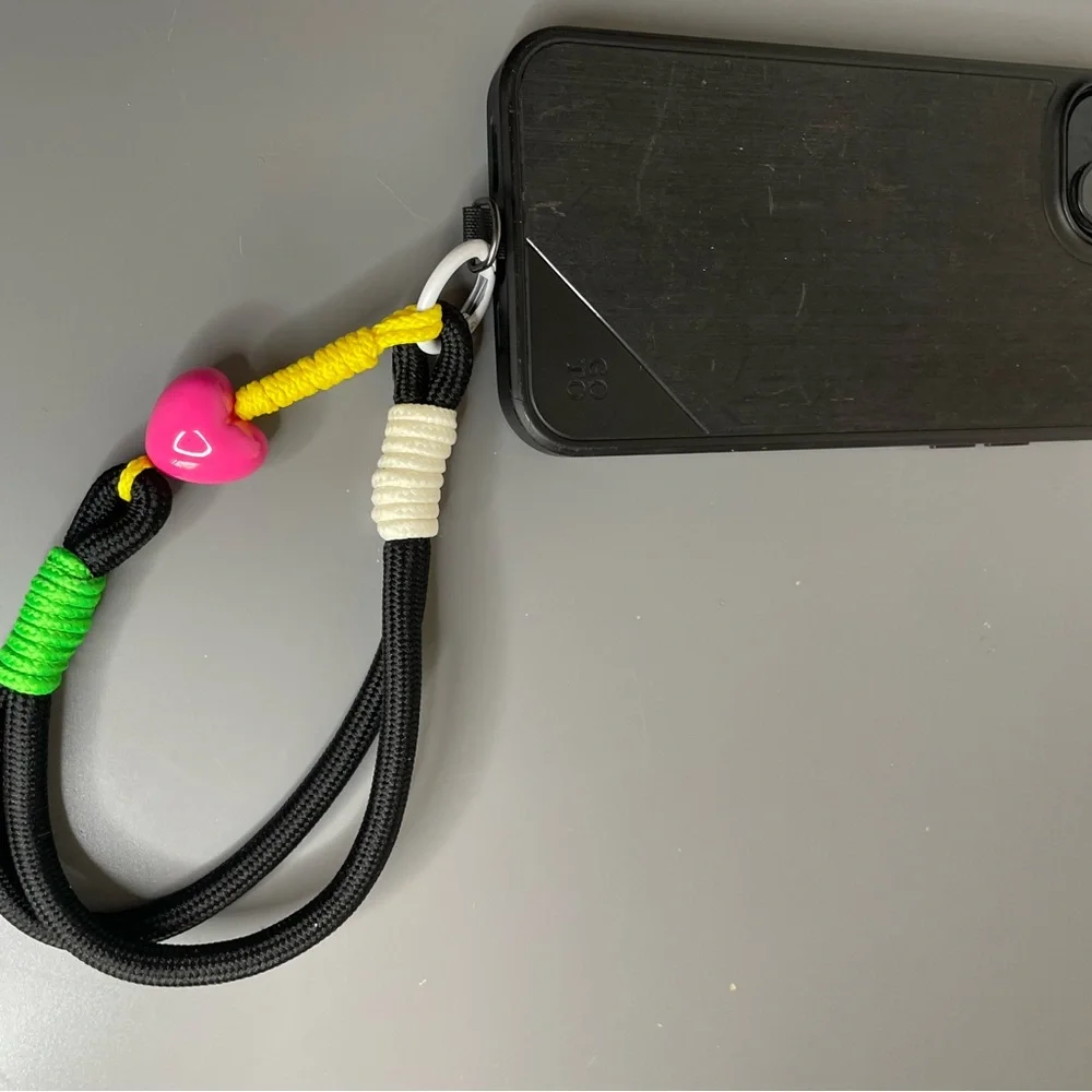 Black Phone Wrist Lanyard with Neon Accents and Pink Heart Bead